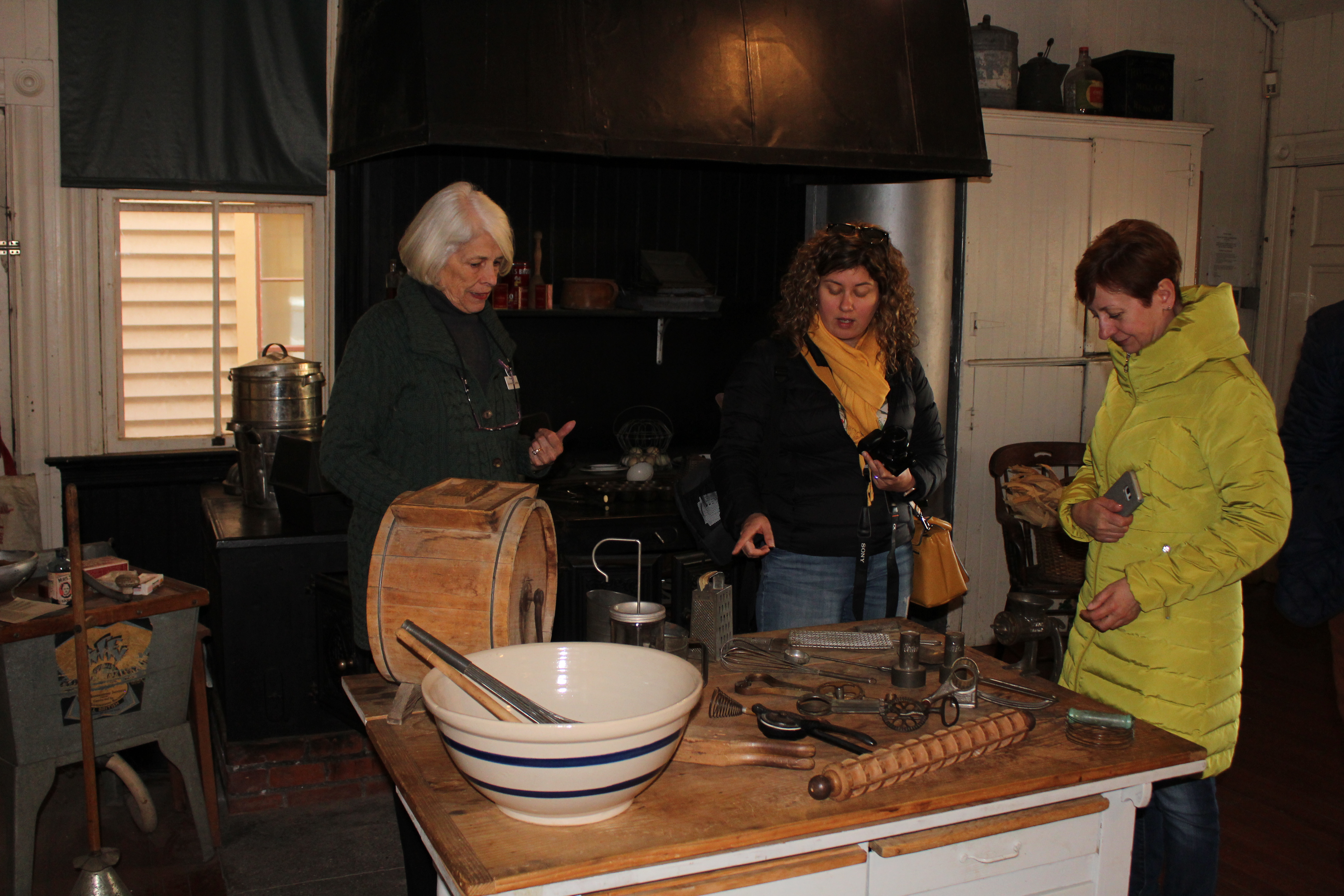 visitors touring toscano kitchen with docent